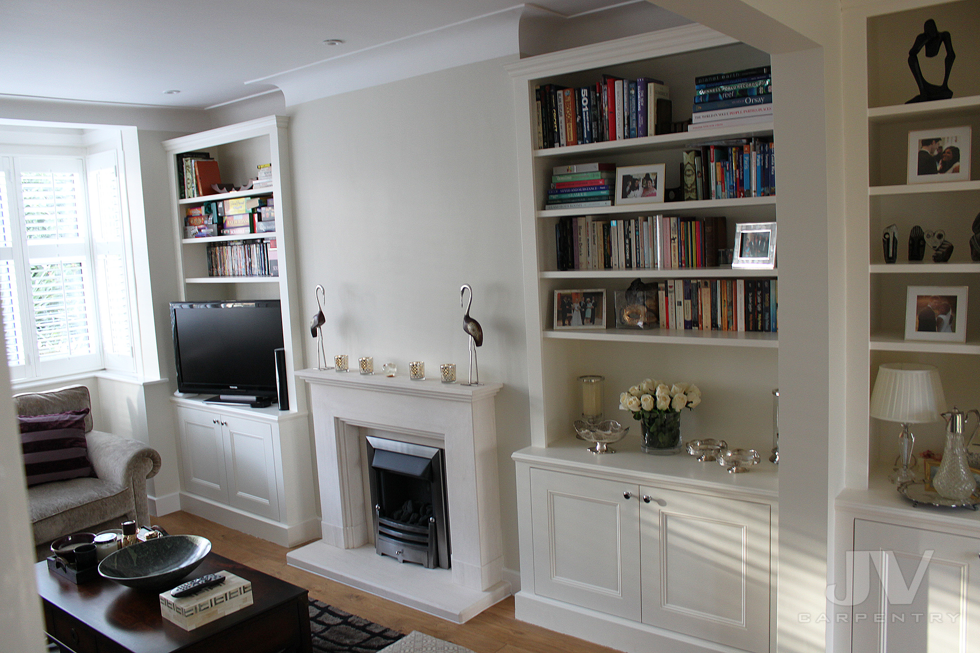 Living Room With Alcoves And Fireplace