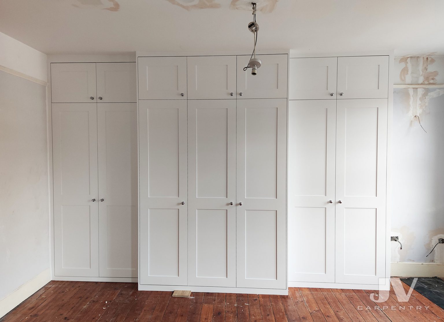 Fitted wardrobes around chimney breast | JV Carpentry