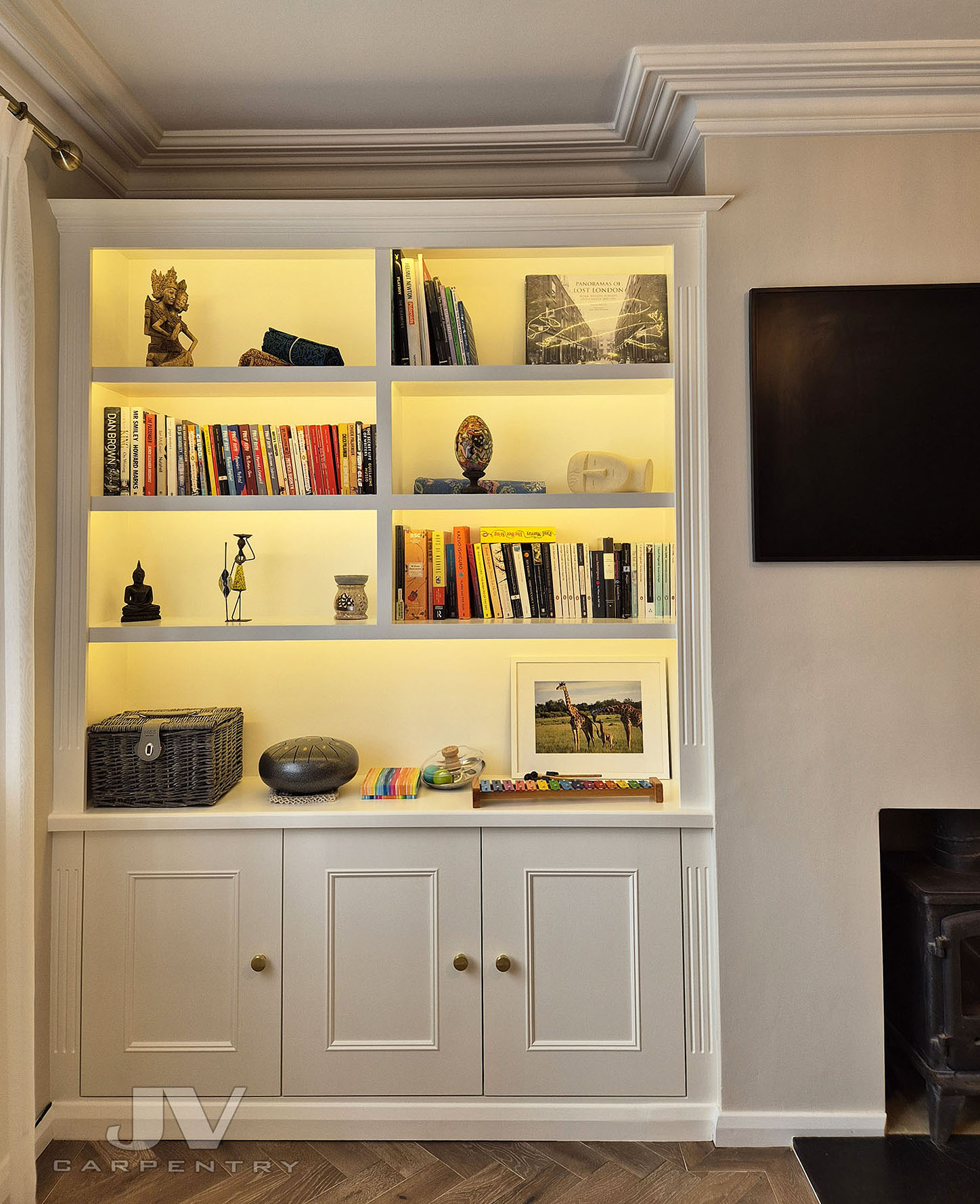 Bespoke fitted bookcase in Central London with integrated lighting