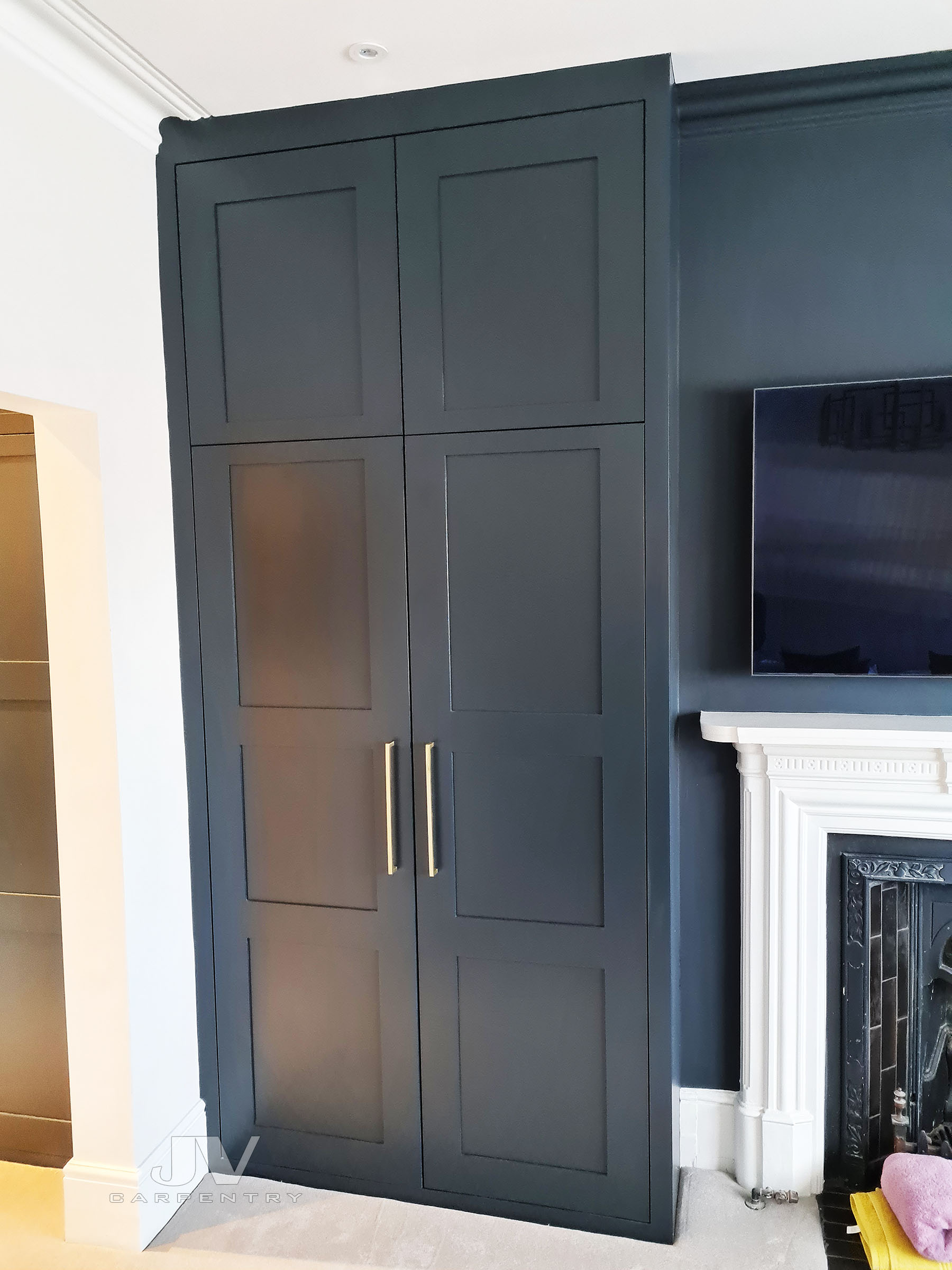 Bespoke fitted wardrobe Central London with hand-painted shaker doors