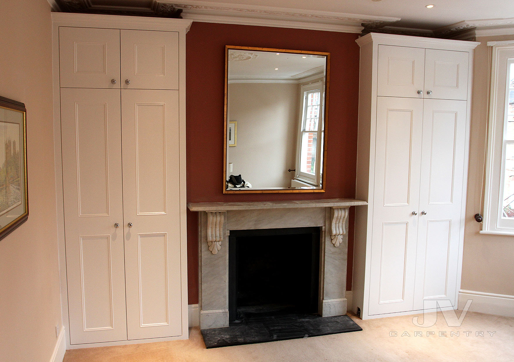 A pair of traditional alcove fitted wardrobes 